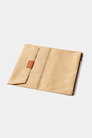 Beige cotton zipper case open flat, showing interior pockets and tab detail