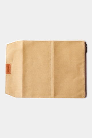 Beige cotton zipper case closed with reinforced side seam and metal zipper