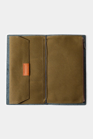 Olive cotton zipper case open flat, showing interior divider panel and zipper track