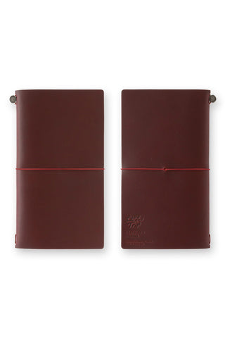 Burgundy leather journal covers with strap band and metal button details