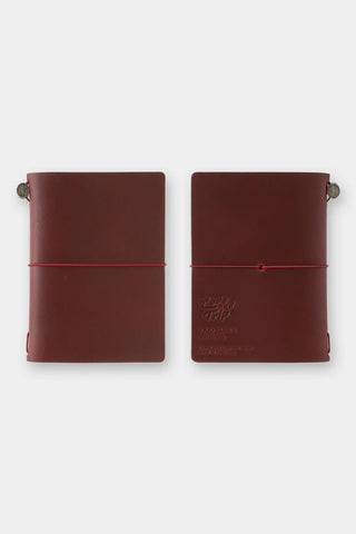Burgundy passport-size notebook set with elastic strap and metal corner snap closures