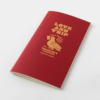Red Traveler's notebook refill booklet with gold Love and Trip cover, top view