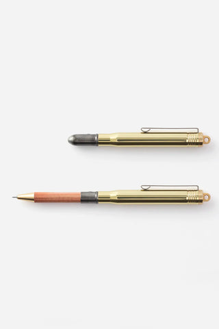 Brass ballpoint pen with gold barrel and dark gray tip