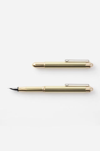 Brass fountain pen with fine nib, showing capped and uncapped views