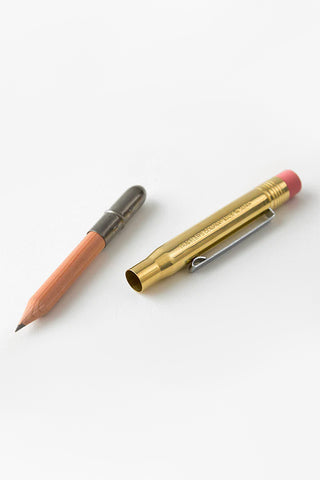 Brass pencil with pink cap and orange wooden tip, alongside a second pencil