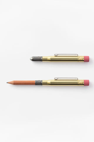 Two brass pencils with pink eraser caps, one with a graphite tip and one capped