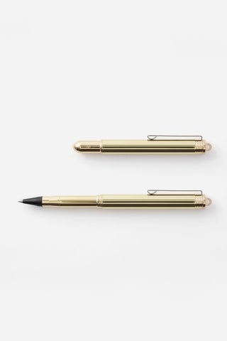 Two brass rollerball pens side by side, with black tips and gold barrels.