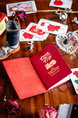 Red "Love and Trip" traveler’s notebook passport refill with gold cat title
