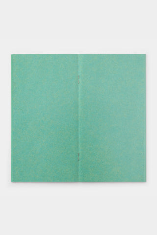 Turquoise kraft notebook refill with two stitched pages shown flat