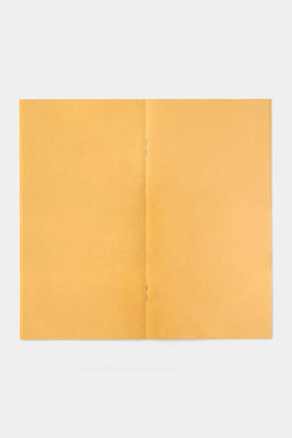 Kraft yellow notebook refill opened to show the two-page spread
