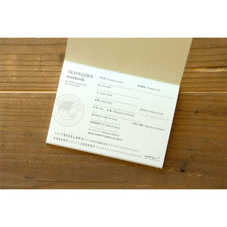 Cream passport notebook back insert with printed maker details and address