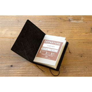 Passport notebook with black cover and beige Departure insert booklet