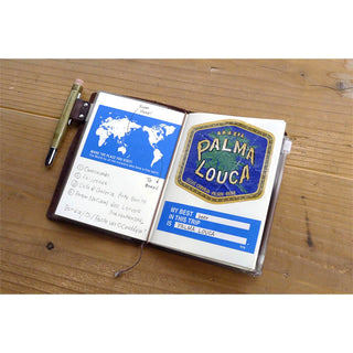 Passport notebook inserts with printed travel notes and cards, cream cover, open view