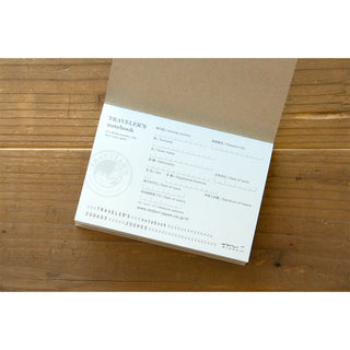 Passport notebook refill sheet with printed text and seal logo on kraft paper