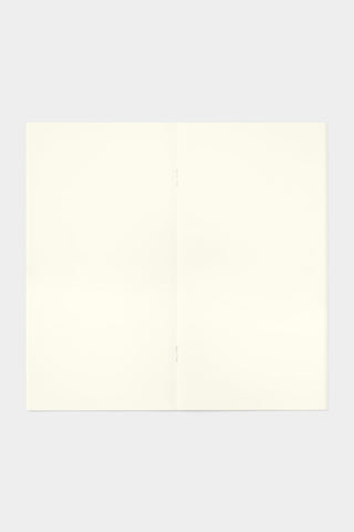 Cream short trip notebook open to blank pages