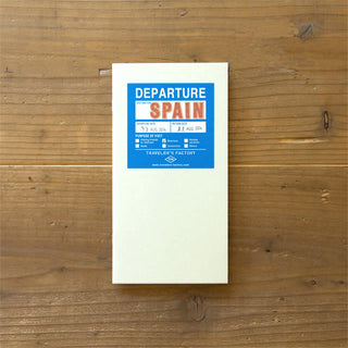 Traveler's Factory cream short trip notebook with blue Departure Spain label