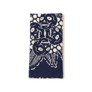 Dark blue tenugui towel with white creature head pattern, folded view