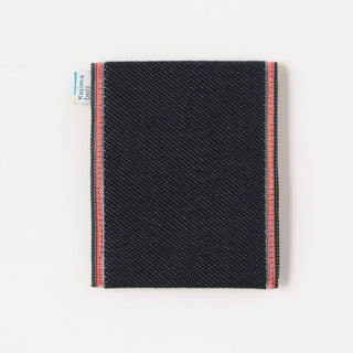 Dark blue denim coin purse back view with red and white edge trim