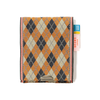 Square coin purse with orange, cream, and navy diamond argyle pattern, top clasp