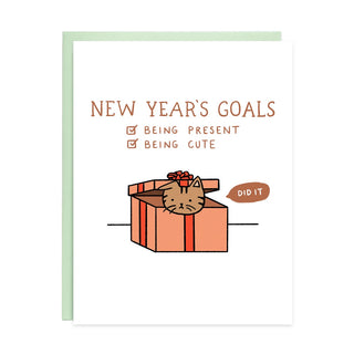 White holiday card with mint border, “New Year’s Goals” text and cat gift illustration