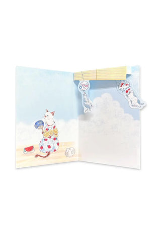 Summer pop-up greeting card open to reveal 3D cloud scene with seated cat