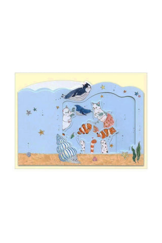 Pop-up aquarium greeting card with cats and sea animals on light blue.
