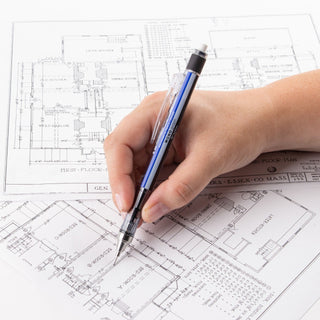 Blue mechanical pencil in hand with exposed tip for drafting and sketching.