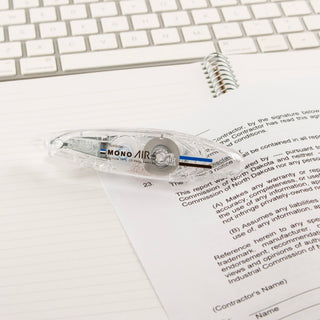 MONO Air Touch correction tape applying tape over lined document