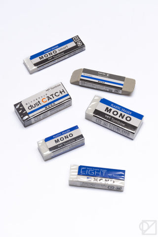 Assorted Tombow MONO sand erasers in blue-labeled boxes on white surface
