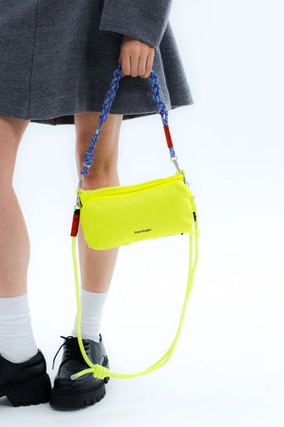 Neon yellow crossbody pouch with blue rope cord and bright green strap ties
