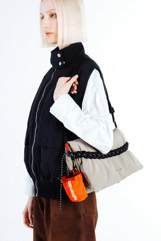 Mini crossbody bag with braided O-rope strap, cream body with black rope strap