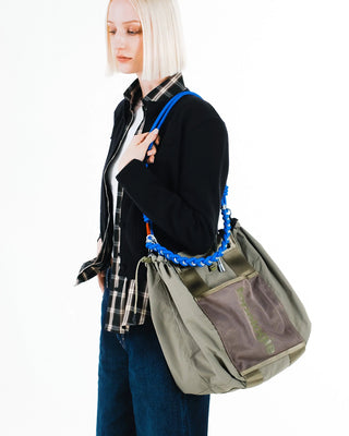 Blue braided O-rope strap and olive shoulder tote bag with knot detailing