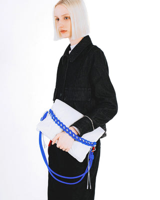 Blue braided O-rope strap with black fabric outfit holding a white tote