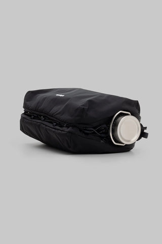 Large black bottle sacoche with side bottle pocket holding a round cap