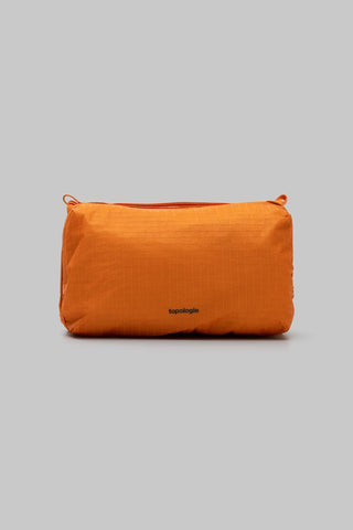 Burnt orange glazed ripstop bottle sacoche with top handle and logo patch