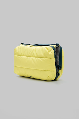 Canary yellow quilted bottle sacoche with navy trim, side view