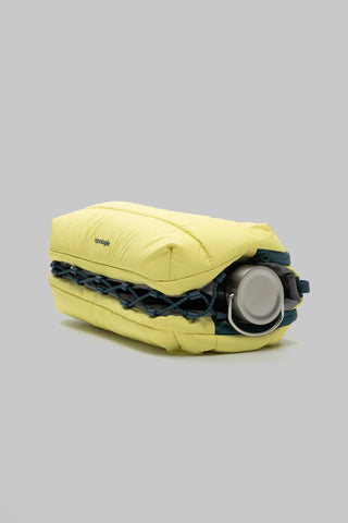 Canary yellow bottle sacoche with grey bottle and navy webbing strap, side view