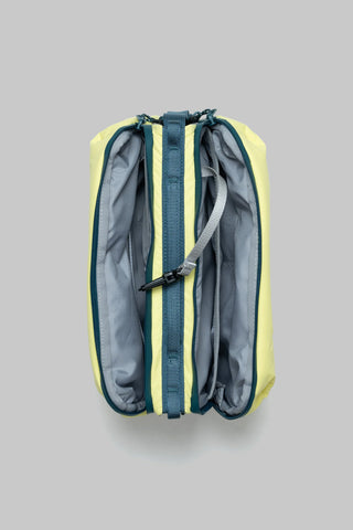Canary yellow bottle sacoche interior open, showing grey lining and navy zipper