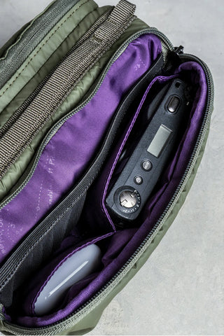 Green and purple Topologie bottle sacoche interior with elastic accessory slots