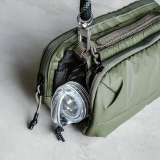 Green Topologie bottle sacoche with bottle holder and side carabiner clip