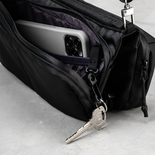 Black Topologie bottle sacoche interior with phone sleeve and key on zipper pull