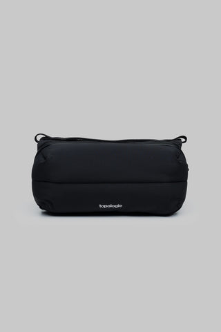 Topologie medium bottle sacoche bag, black, rounded crossbody with top drawcord.