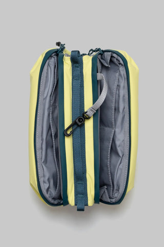 Canary yellow bottle sling bag interior with gray lining and teal webbing