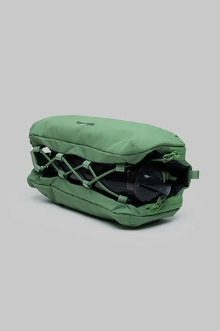 Topologie medium bottle sling bag in ivy green, open interior with bottle straps