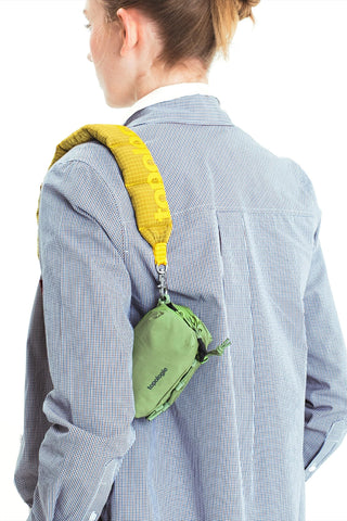 Mini crossbody bag, green body with yellow strap and zipper pocket