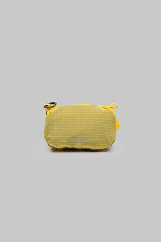 Mini bottle pouch in mustard yellow ripstop with drawstring top and carry loop.