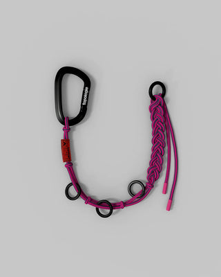 Braided keychain with pink cords, teal accents, black carabiner and metal rings