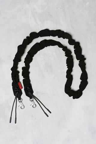 Black bungee strap with metal spring clips and adjustable cords