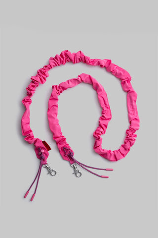 Pink bungee strap with ruffled tech-sateen cord and metal clips