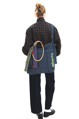 Topologie sling bag with adjustable strap, blue-gray panel and Topologie logo